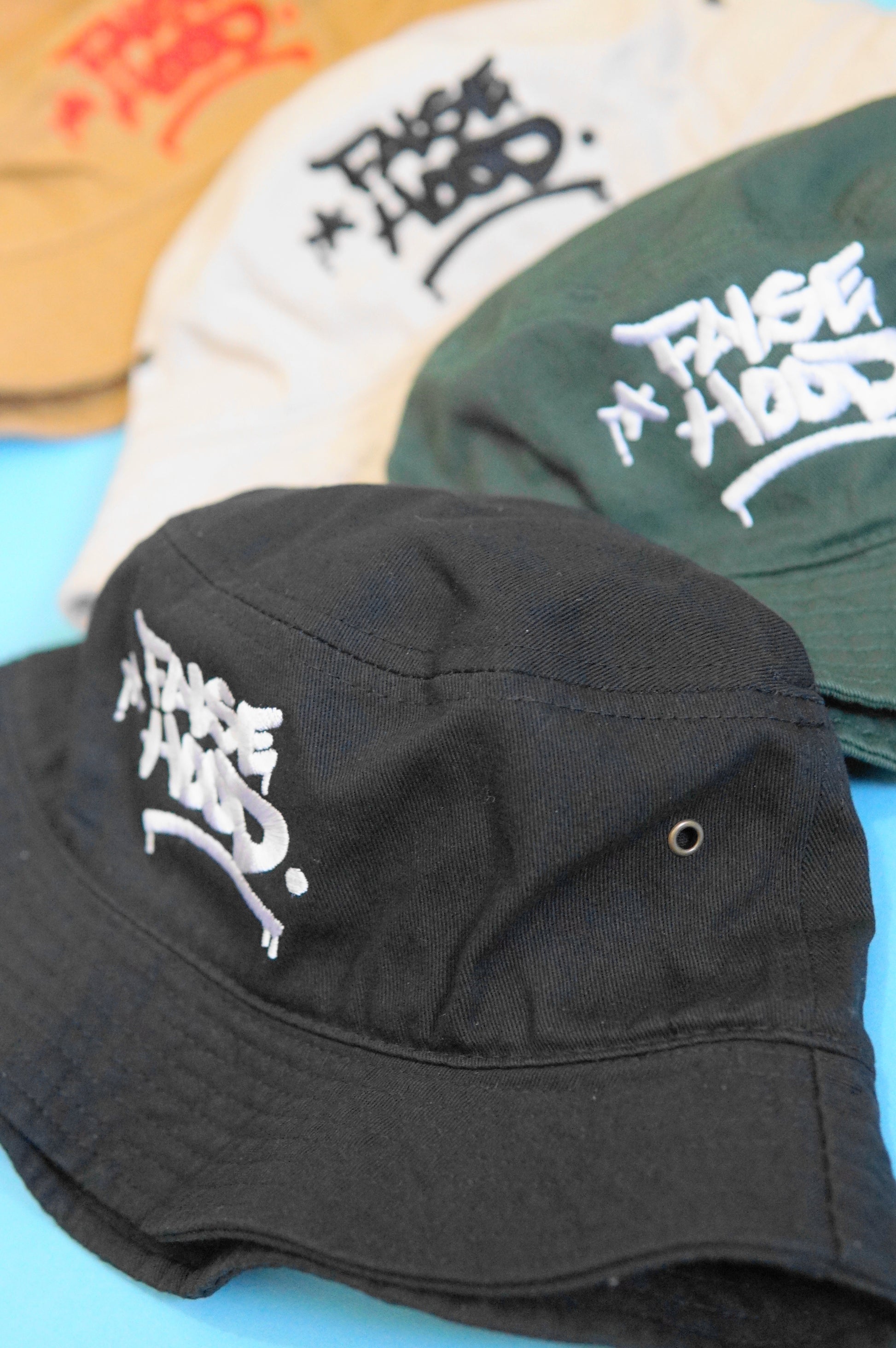 The Big TAG. Bucket Hat - FALSEHOOD.