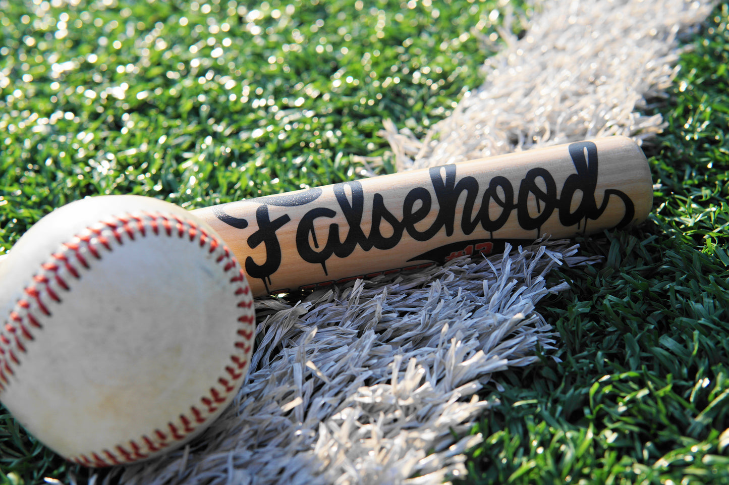 HOMETOWNS Mini Baseball Bat - FALSEHOOD.