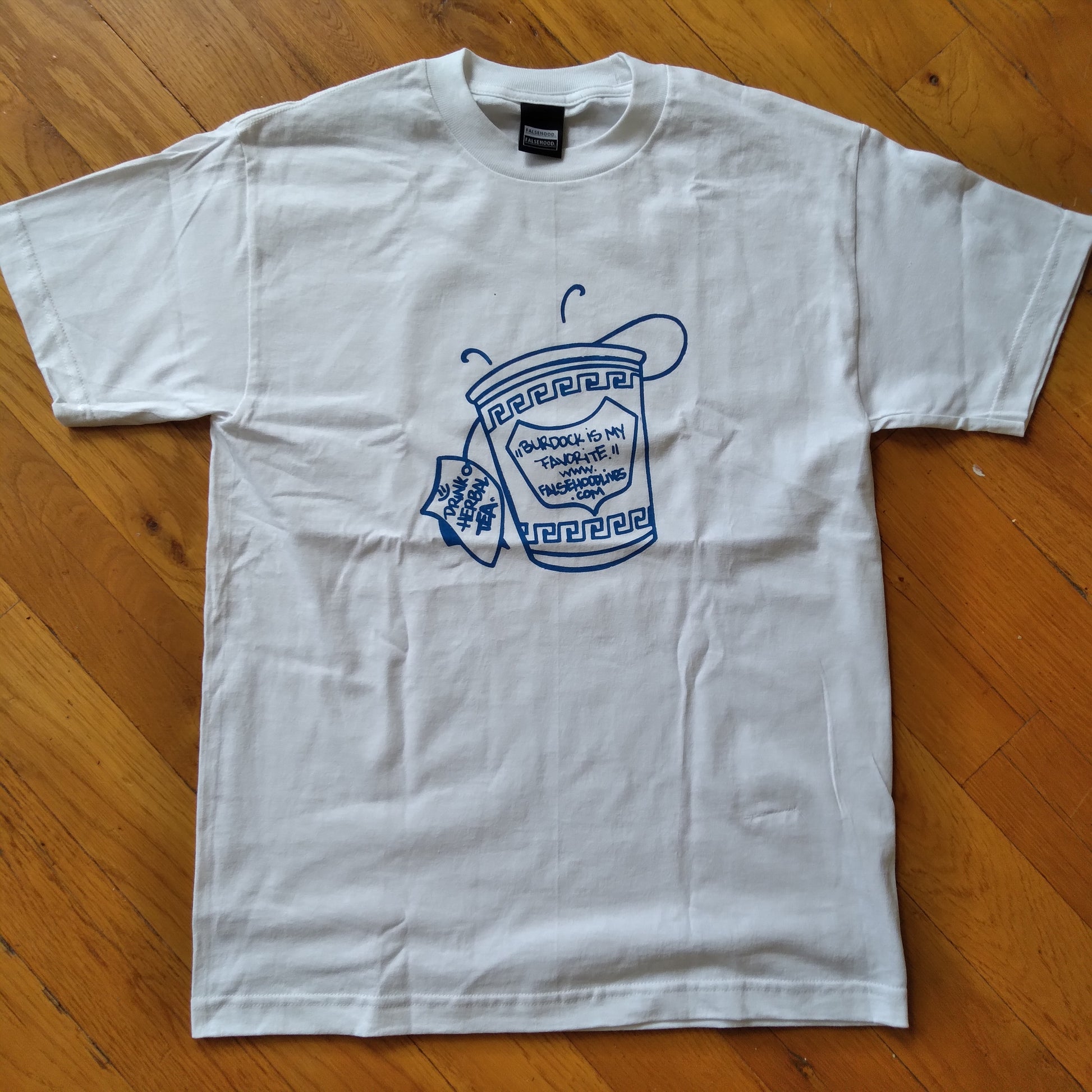 The TEA CUP. Tee - FALSEHOOD.
