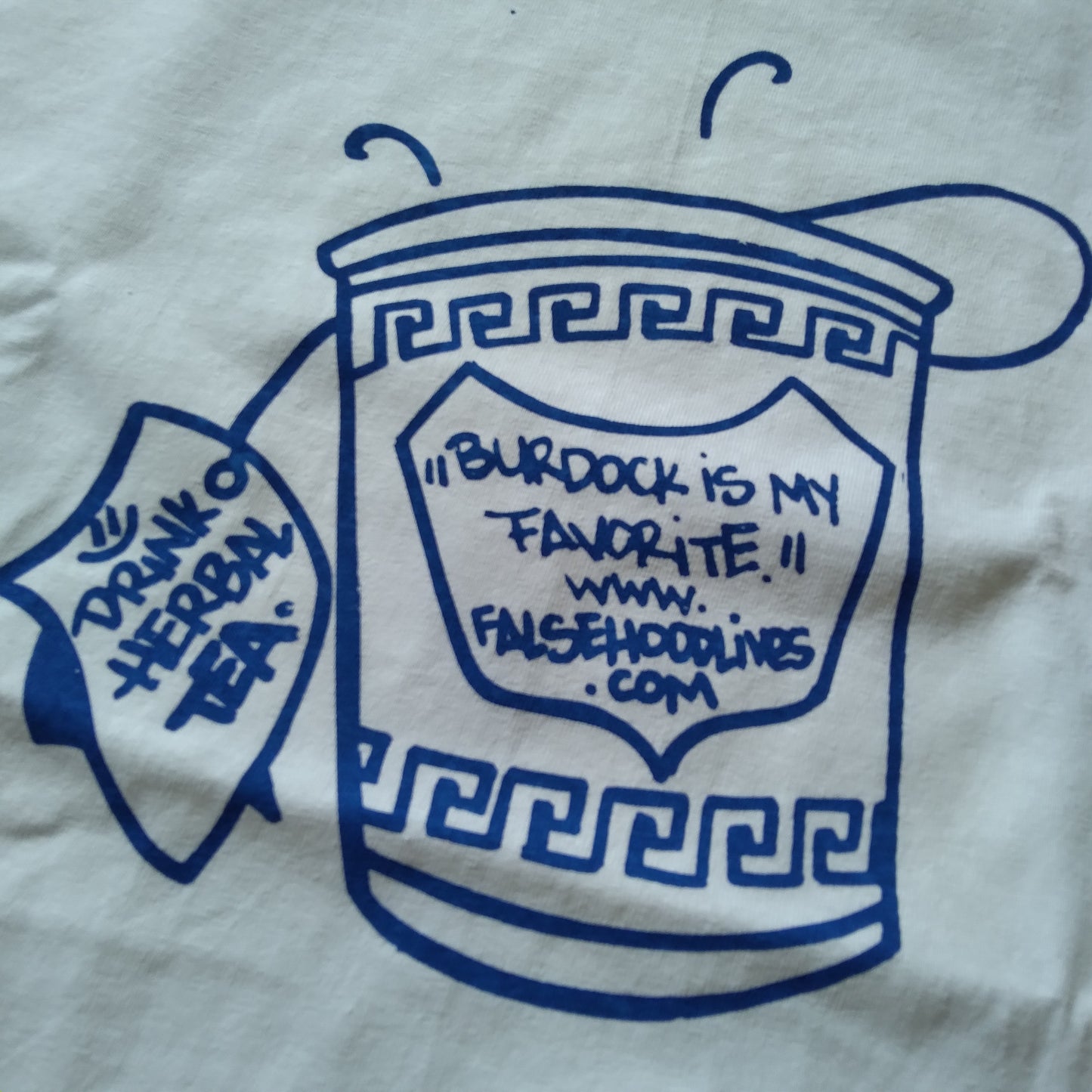 The TEA CUP. Tee - FALSEHOOD.