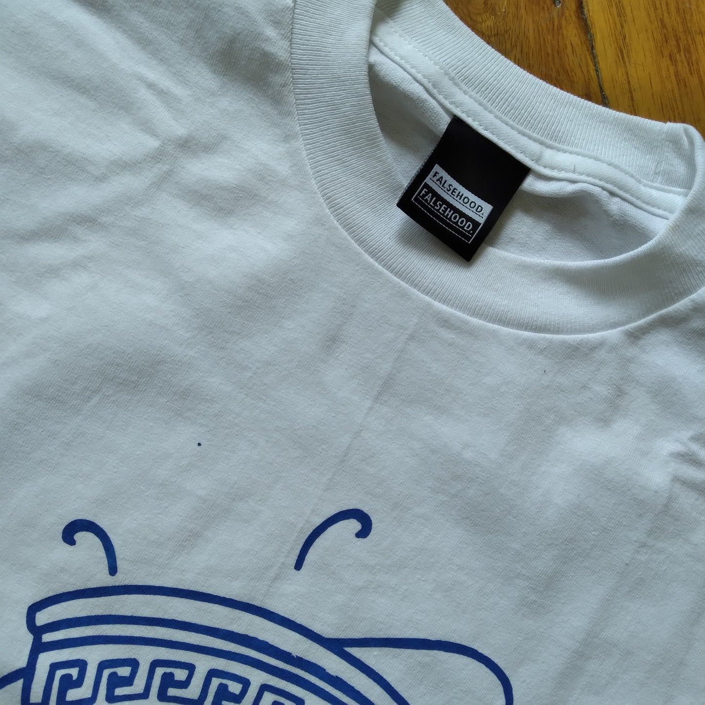 The TEA CUP. Tee - FALSEHOOD.