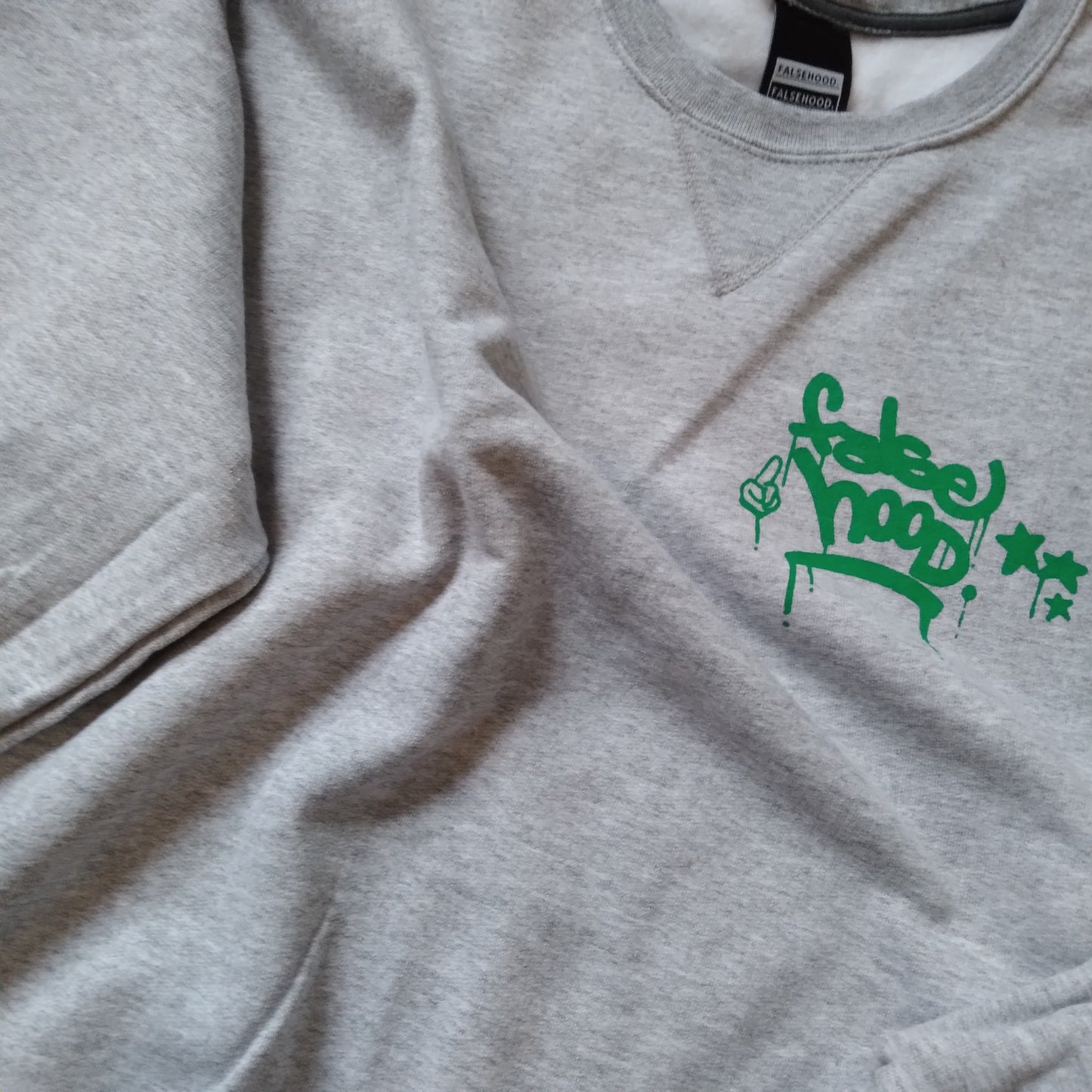 The New TAG. Crewneck Sweater - FALSEHOOD.