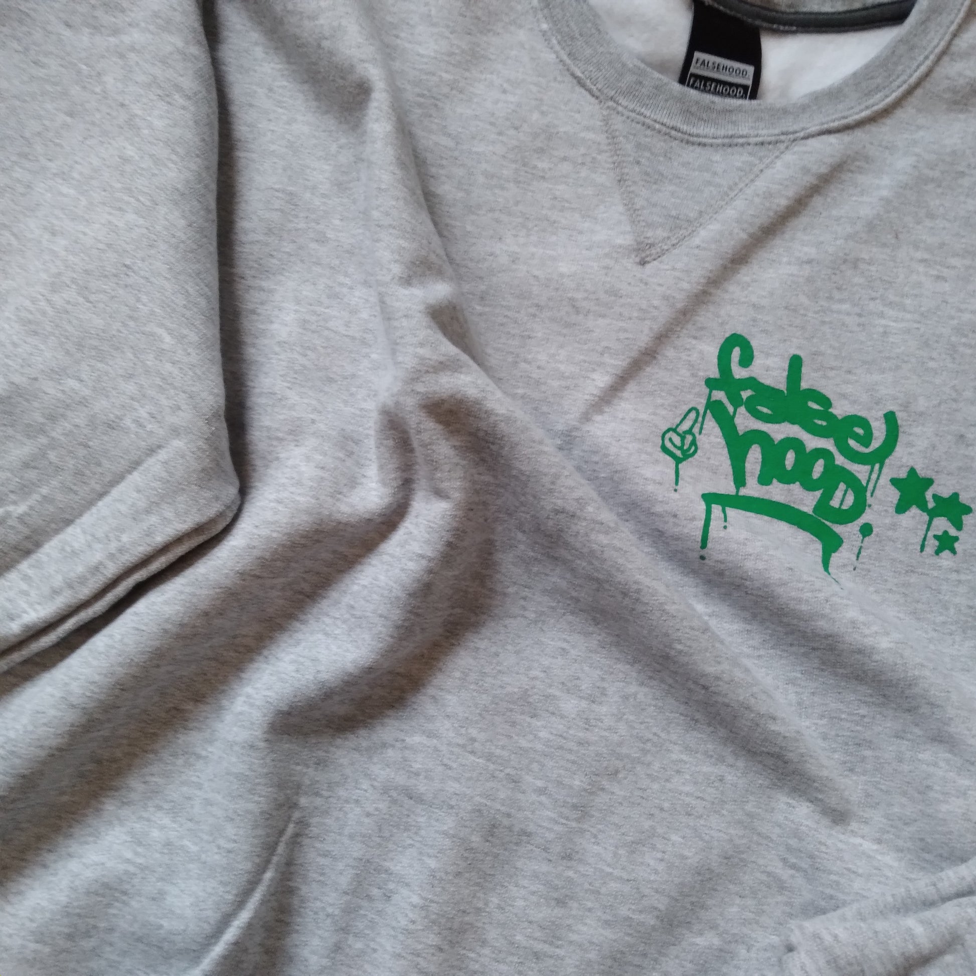 The New TAG. Crewneck Sweater - FALSEHOOD.