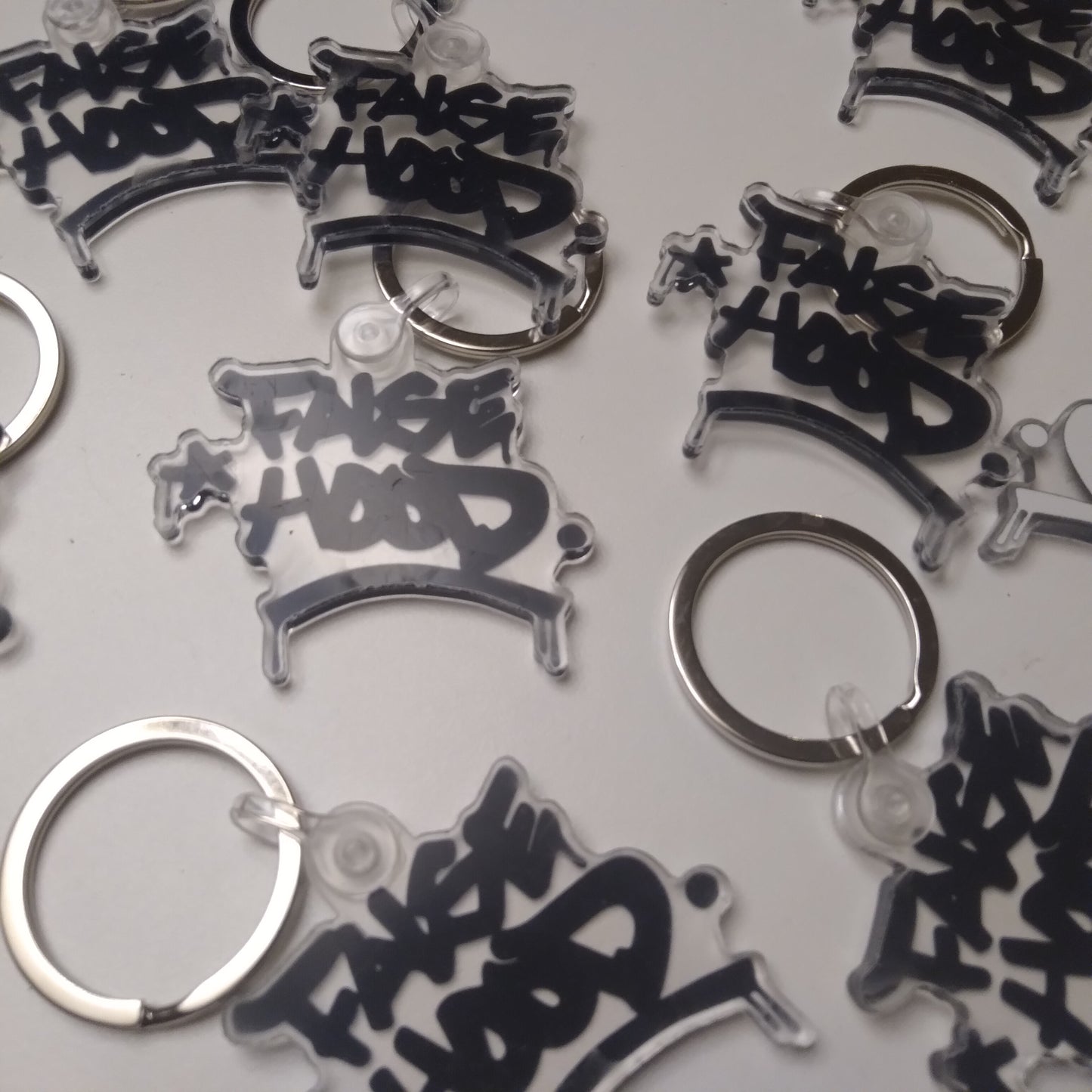 Big TAG. Key Chain - FALSEHOOD.