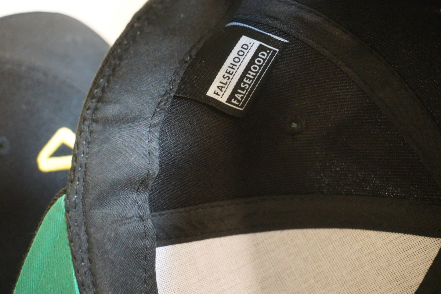 GWC - BATES Snapback Cap - FALSEHOOD.