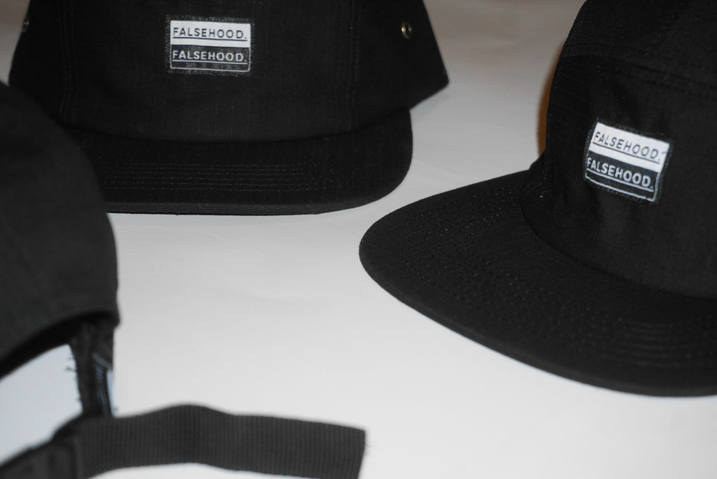 BOX LOGO. Camper Cap - FALSEHOOD.