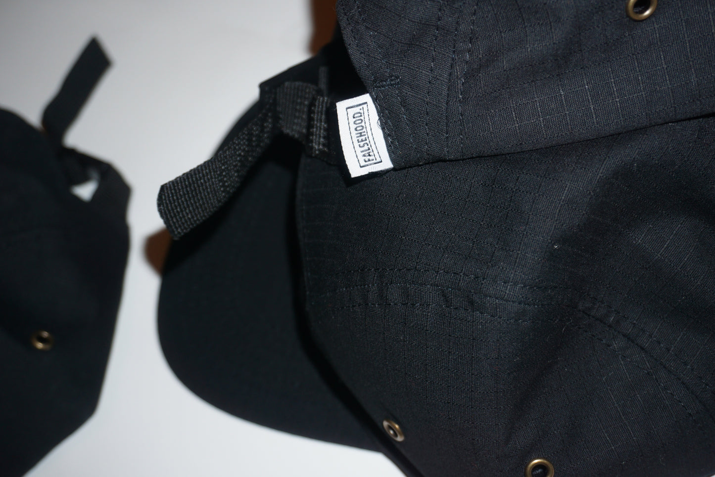 BOX LOGO. Camper Cap - FALSEHOOD.