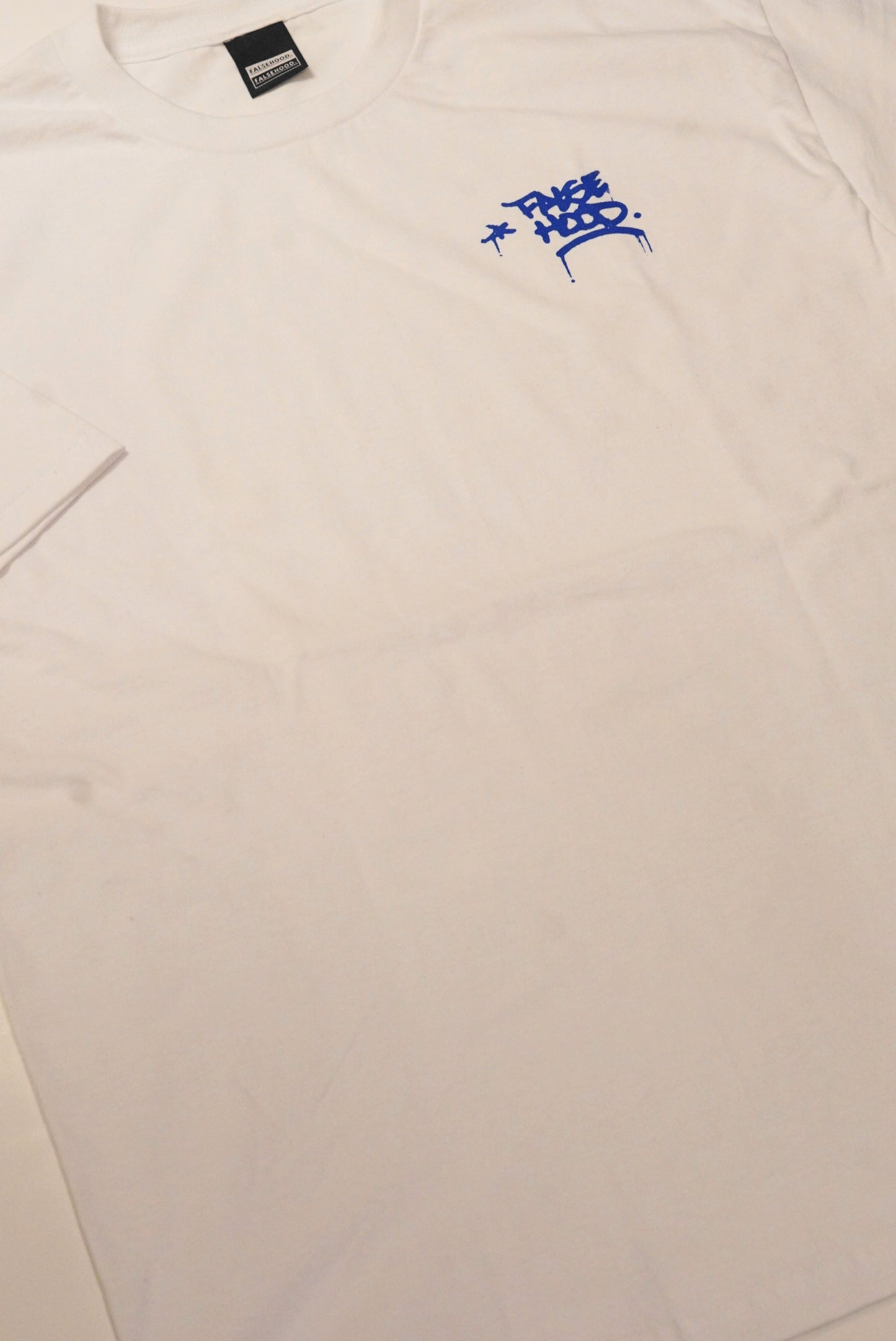 The TAG. Tee - FALSEHOOD.