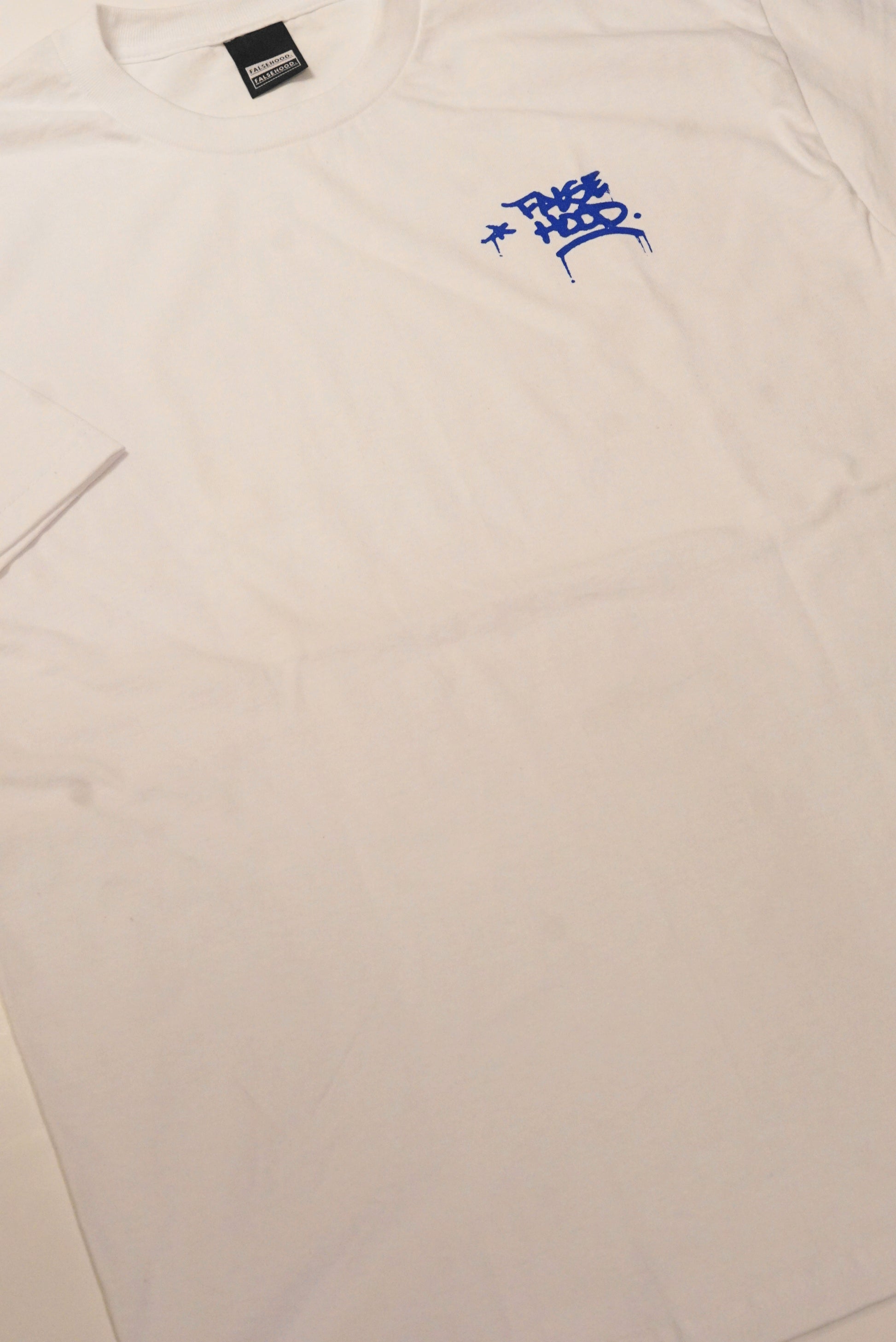 The TAG. Tee - FALSEHOOD.