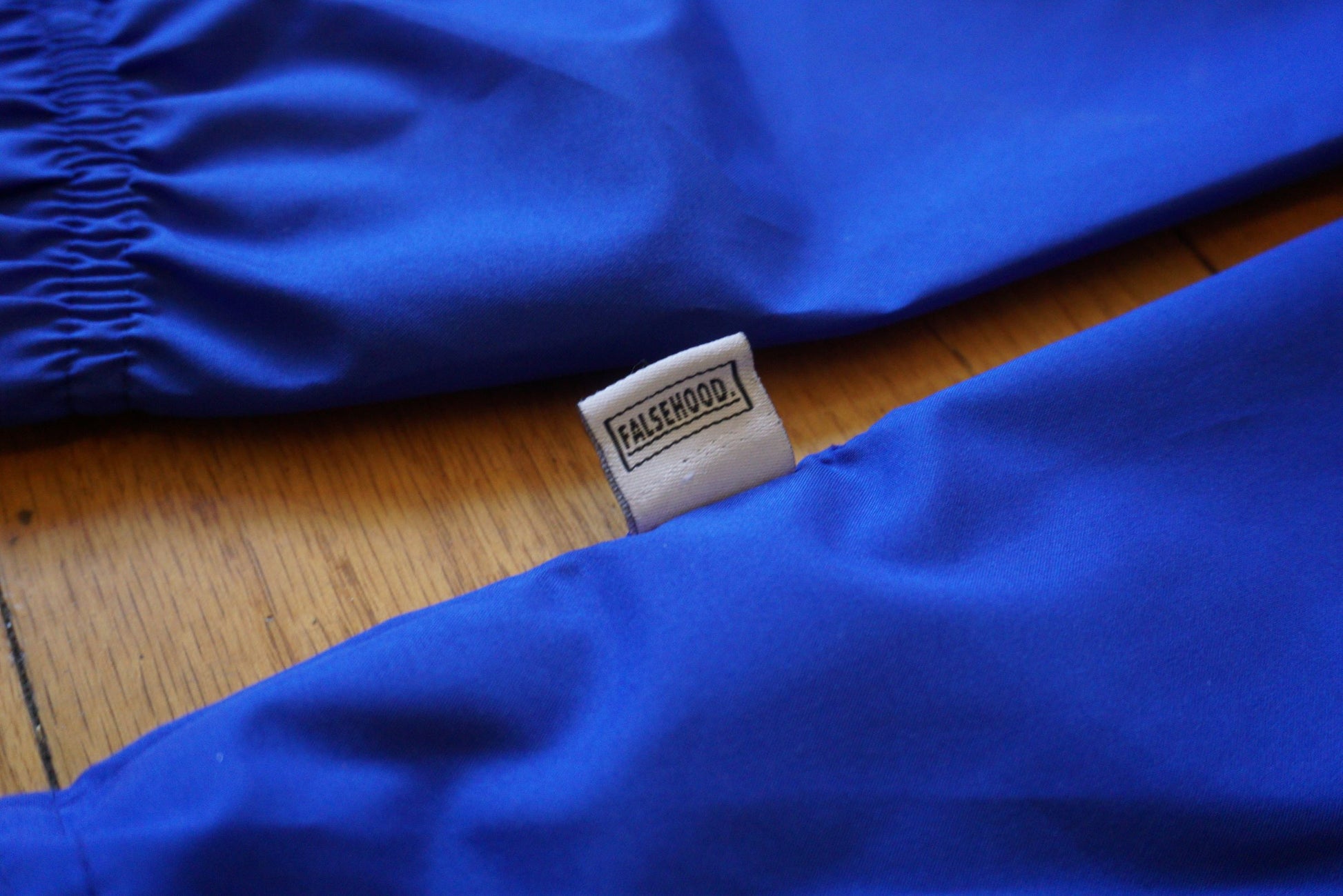 FAMILY. Quarter-Zip Pullover Windbreaker - FALSEHOOD.