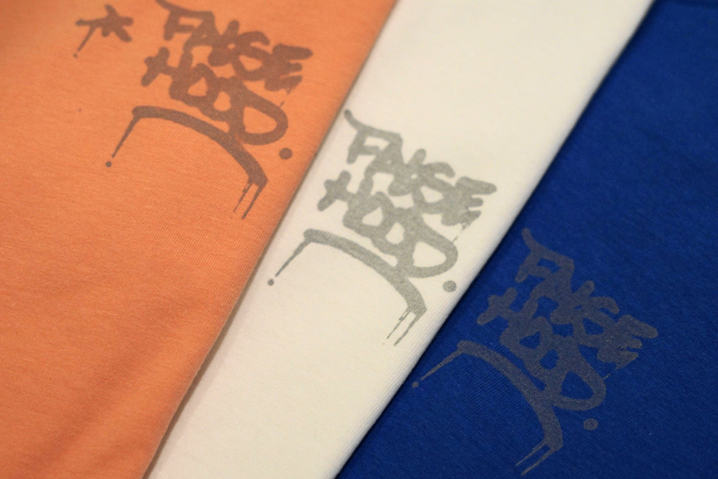 The Reflective TAG. Tee - FALSEHOOD.