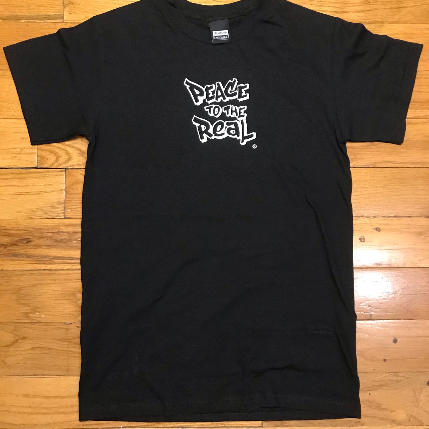 PEACE TO THE REAL. © Tee - FALSEHOOD.