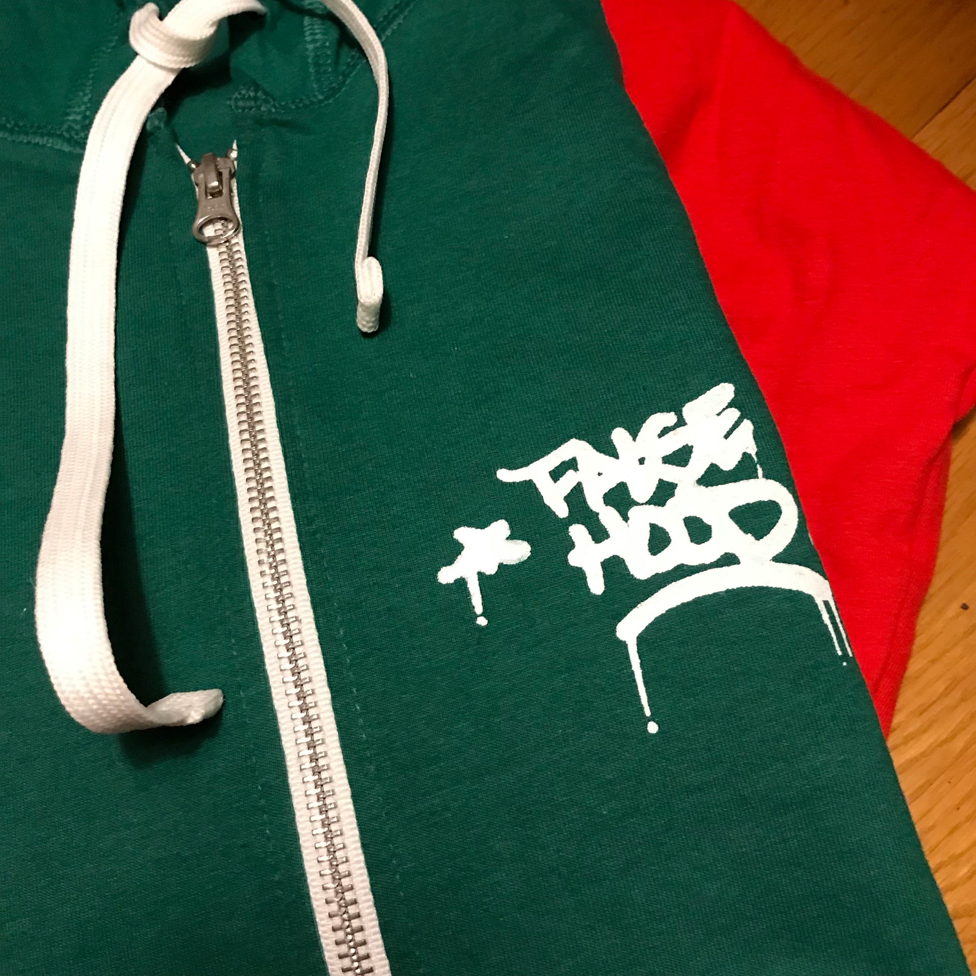 The Big TAG. Full-Zip Up Hoody - FALSEHOOD.