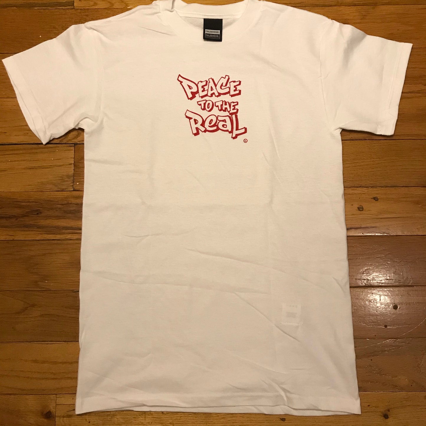 PEACE TO THE REAL. © Tee - FALSEHOOD.