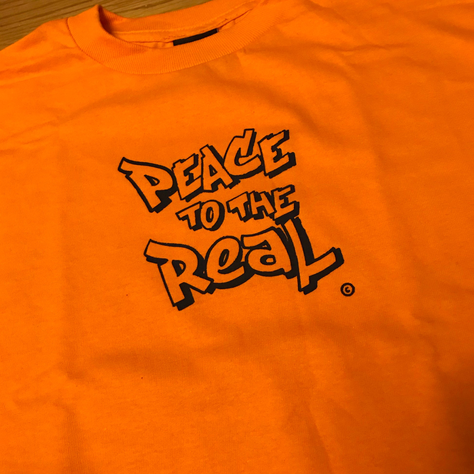 PEACE TO THE REAL. © Tee - FALSEHOOD.