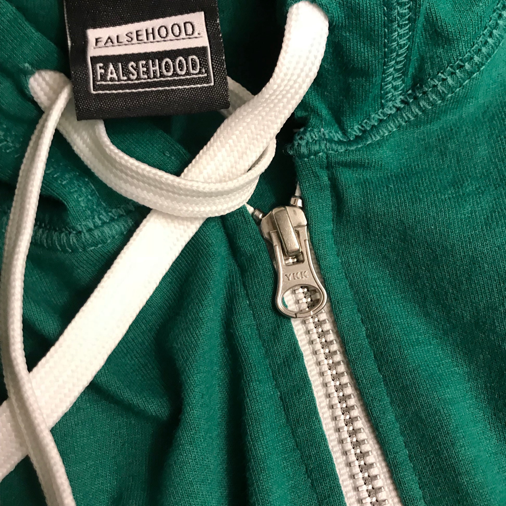 The Big TAG. Full-Zip Up Hoody - FALSEHOOD.