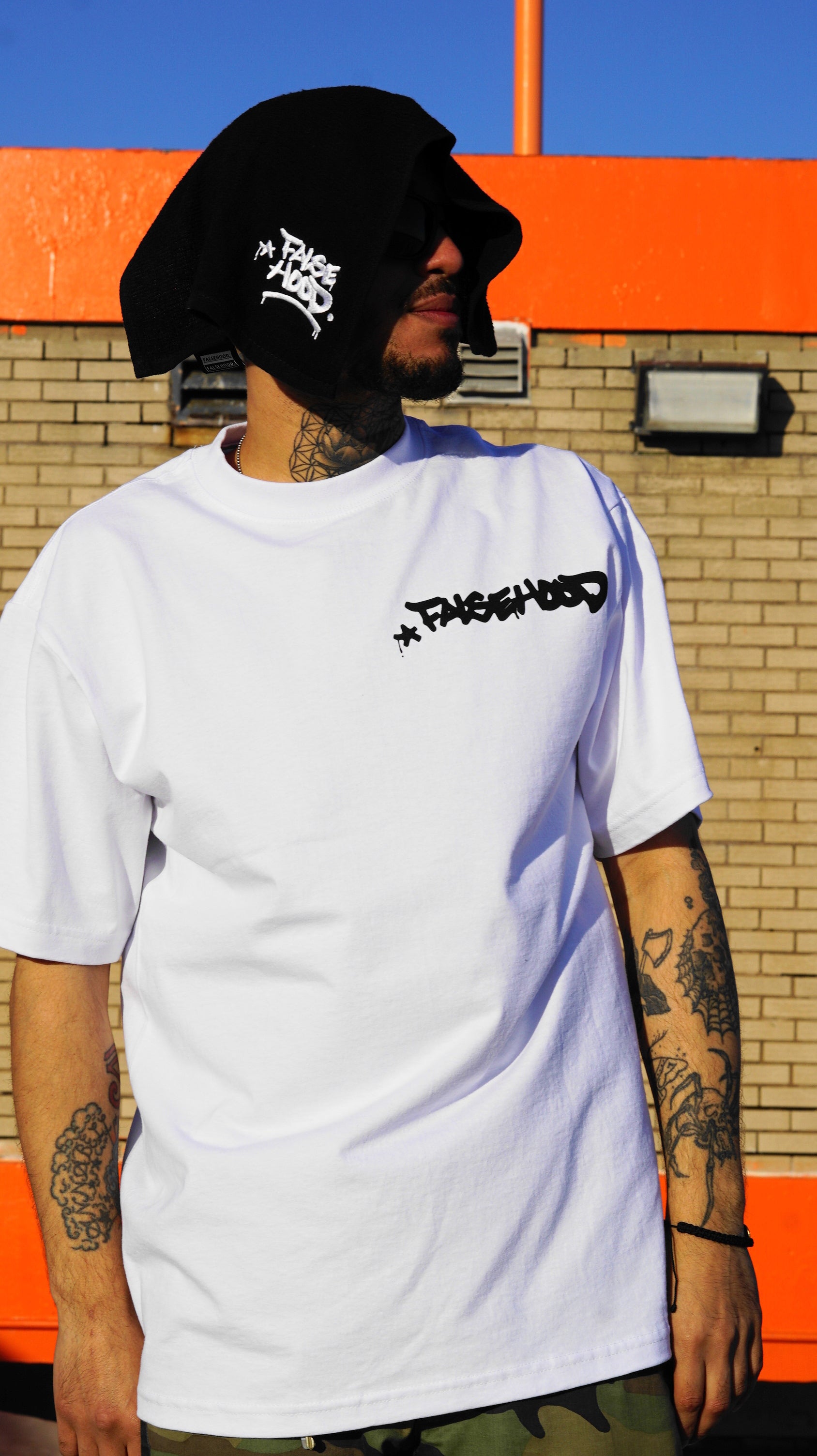 The Big TAG. Runner Tee - FALSEHOOD.