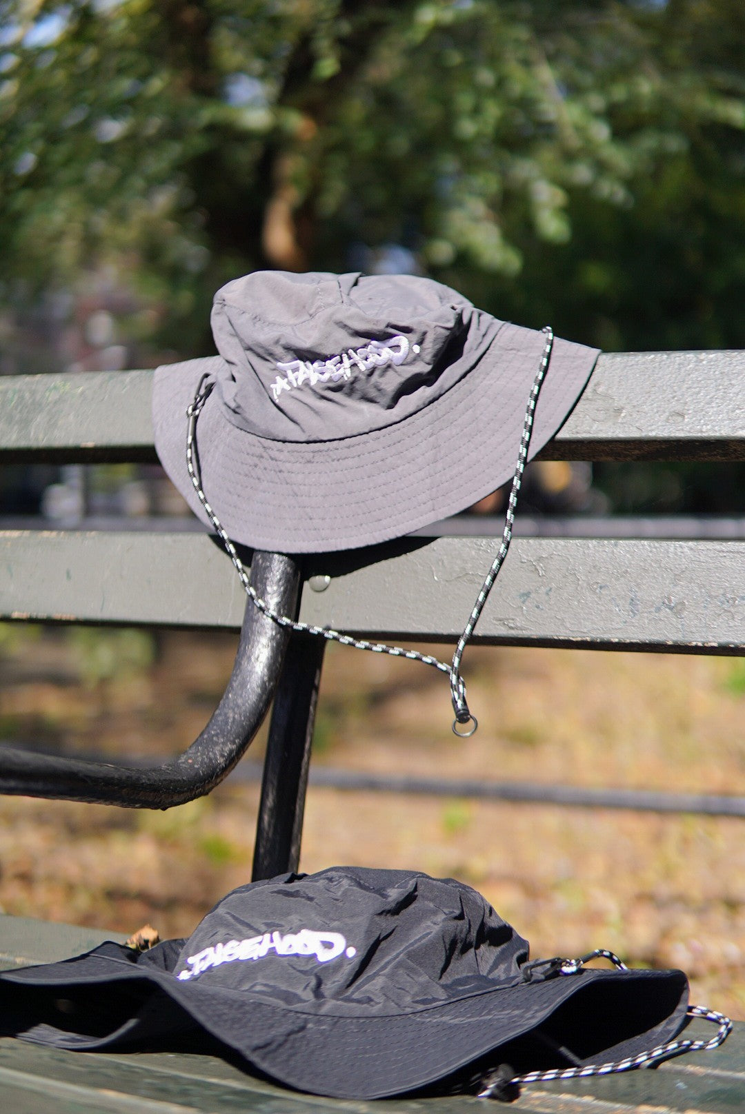 The Big TAG. Runner Waterproof Bucket Hat - FALSEHOOD.
