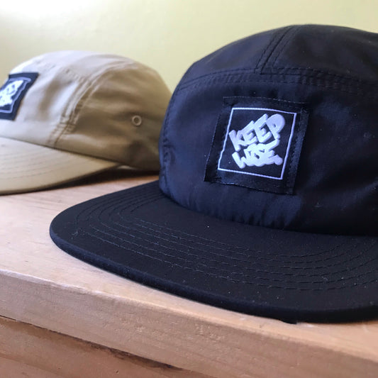 KEEP WISE. Camper Cap - FALSEHOOD.